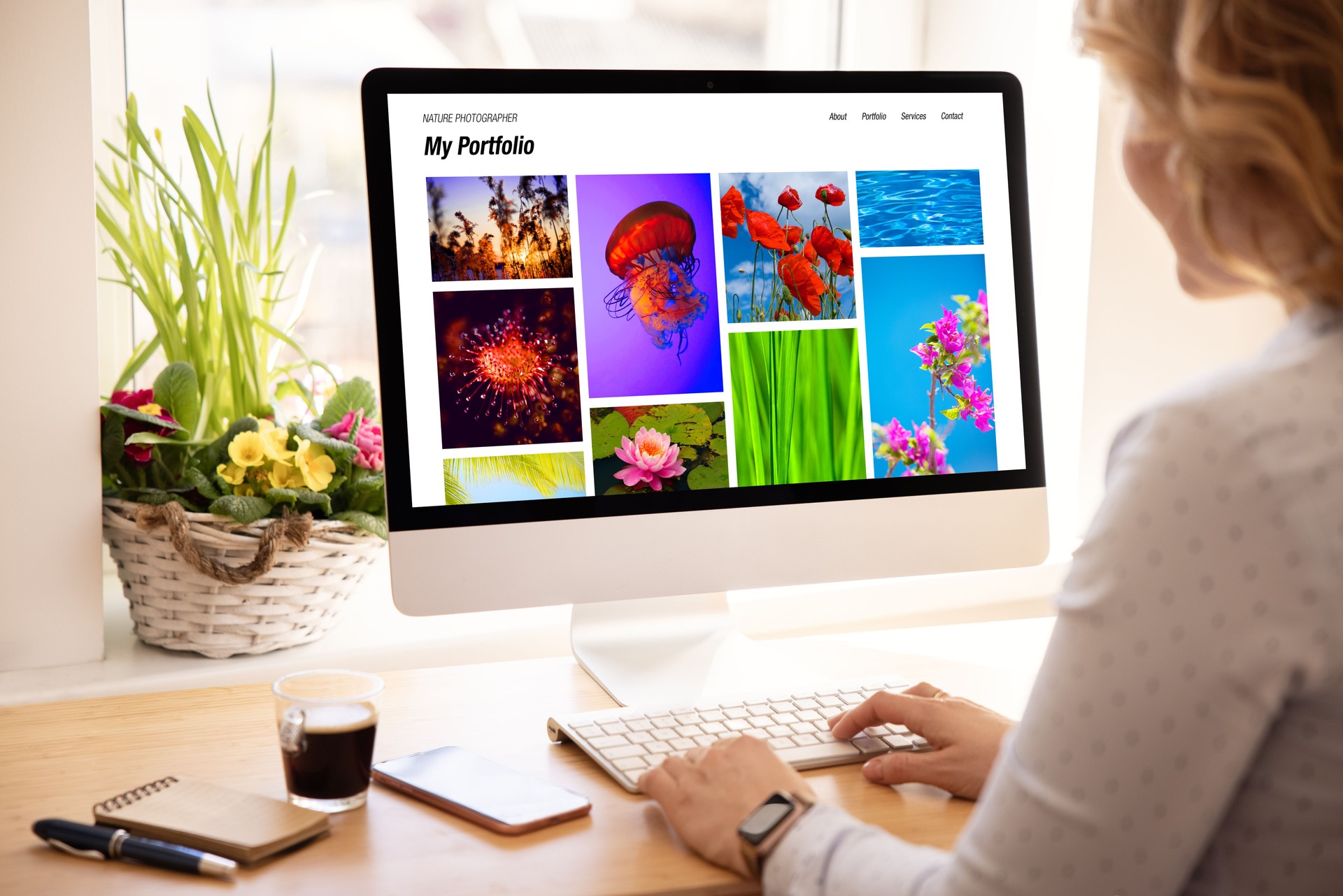 Woman viewing photography portfolio website on computer screen